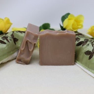 By the Sea Soap Shoppe brown Sandalwood Potato Soap bar. Potato soap is made with potato water which brings vitamins, minerals and other nutrients which are good for your skin. Soap has a brown colour. Handmade in PEI, natural ingredients, vegan. $7.00 each, 3 for $20.00