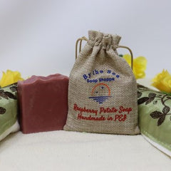 By the Sea Soap Shoppe Raspberry Potato soap comes with its own little potato bag. Soap is a reddish brown colour and has a raspberry scent. Handmade in Prince Edward Island. Natural ingredients, vegan. $10.00